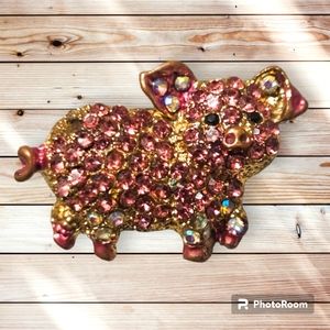 Golden pig brooch
